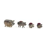 Three silver pig pin cushions, two stamped 925 measuring 2.5 cm long, and a white metal pig vesta