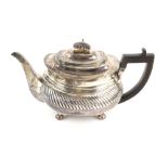 George III silver teapot with a band of gadrooned decoration, on bun feet, by Charles Price, London,