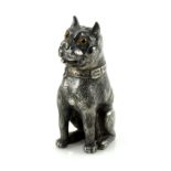 White metal pepperette in the form of a pug, the seated figure with glass eyes, with maker's mark
