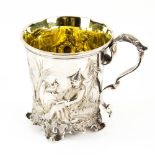 Victorian silver christening mug, embossed and moulded with an Oriental scene, on four shaped