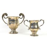 Two George V silver trophy cups, the first by E S Barnsley & Co, Birmingham 1910, 23 cm wide