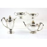 George V silver four piece tea service, comprising teapot, hot water jug, cream jug and sugar