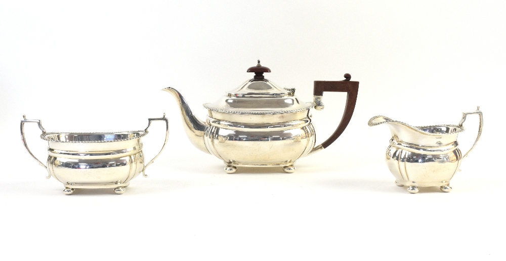 George V silver three-piece tea service, comprising teapot, sugar bowl and cream jug, by R&Co,