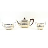 George V silver three-piece tea service, comprising teapot, sugar bowl and cream jug, by R&Co,