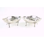 George V pair of silver baskets, with pierced decoration and on four feet, by R Comyns, London 1926,