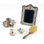 Collection of silver-mounted items to include a flower design chamberstick, 13.5 cm, two caddy