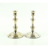 Elizabeth II silver pair of dwarf candlesticks, by William Comyns & Co. London 1977, on stepped