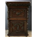 18th century carved oak escritoire, with a drawer above fall front enclosing a fitted interior, a