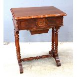 Mahogany work table opening to reveal a lift out tray on turned legs united by a central stretcher