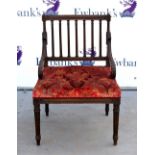 Early 20th century mahogany hall chair with carved back and padded seat, on reeded legs .