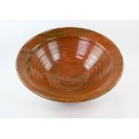 Terracotta brown and green glazed blood letting bowl, diameter 55cm . 18cm high Provenance: Part