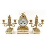 Late 19th/early 20th century French gilt metal and marble clock garniture, the clock of barrel form,