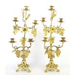 Pair of gilt metal and grapevine decorated five light candelabra, 60cm high,.