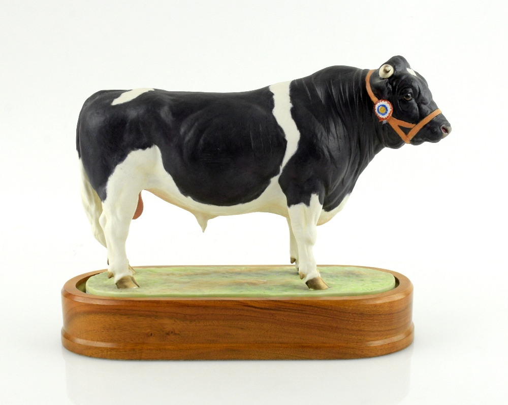 Royal Worcester porcelain Friesian Bull modelled by Doris Lindner 1964 with a wooden plinth 16cm x