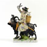 19th century Dresden tailor holding pair of scissors and riding a goat , cross sword mark to base,