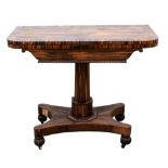 19th century coramandel folding card table on column support to shaped bases on reeded bun feet,