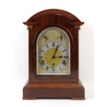 Mahogany cased three train mantle clock 43cm high.