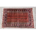 Red ground Persian type prayer mat, 150cm x 90cm , and a Red ground Afghan type rug 180cm x 150cm .