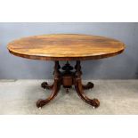 Victorian rosewood oval loo table on turned and carved supports, 75cm x 106cm x 98cm,.