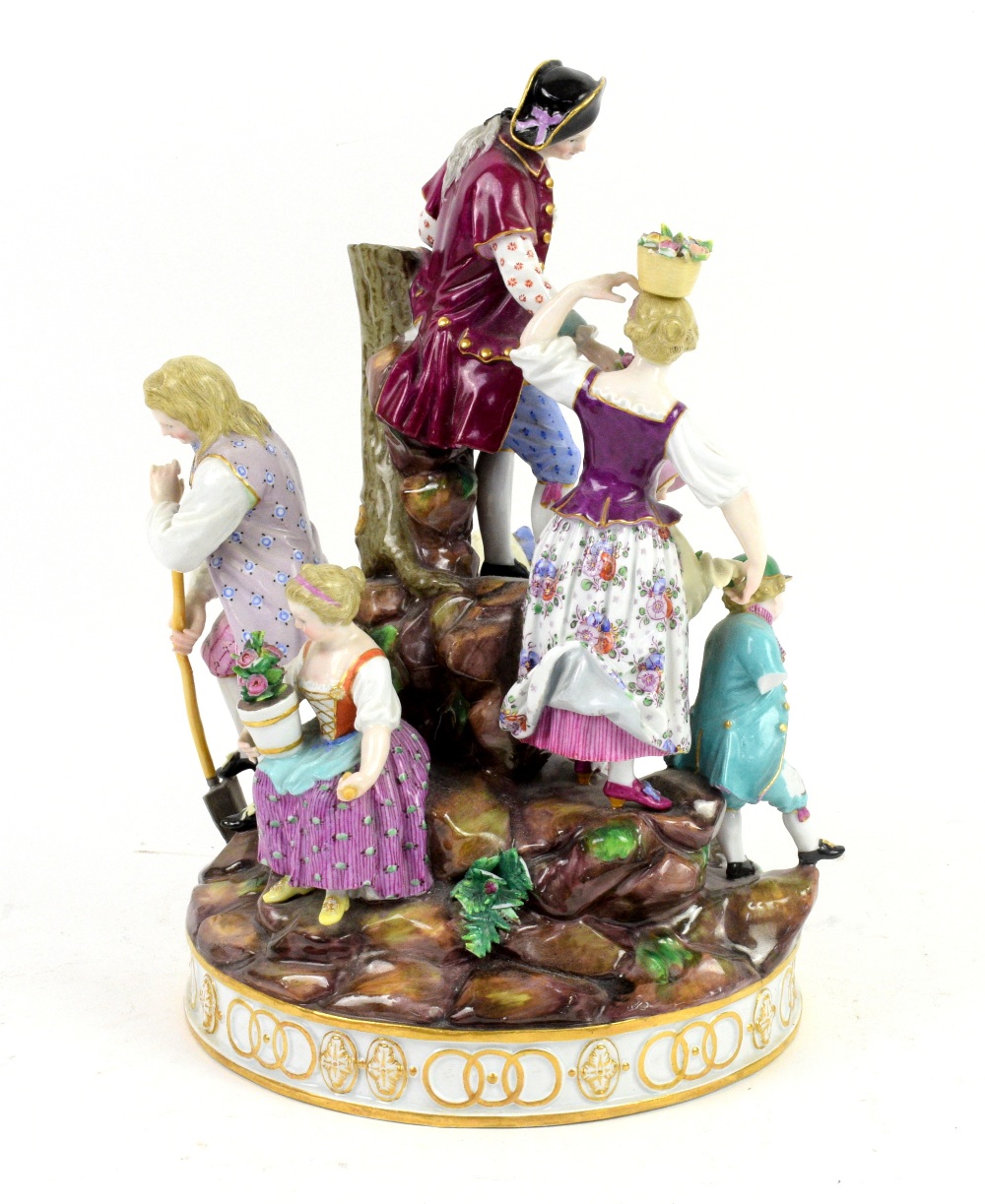 Meissen porcelain figural group of man, women and child digging and gathering flowers on a rocky - Image 2 of 6