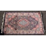 Persian cream ground silk rug, with multiple borders, the centre with concentric medallions, 157cm x