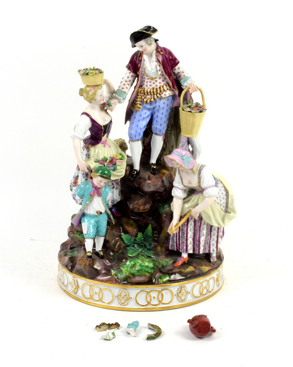 Meissen porcelain figural group of man, women and child digging and gathering flowers on a rocky