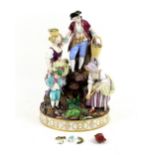 Meissen porcelain figural group of man, women and child digging and gathering flowers on a rocky