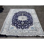 Iranian Nain wool and silk cream ground carpet centre with repeating foliate forms and central