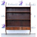 19th century mahogany wall shelf with adjustable shelves above three drawers, 114cm x 84cm .