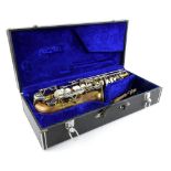 Delta brass saxophone impressed No.7302009, 67cm long, in fitted case..