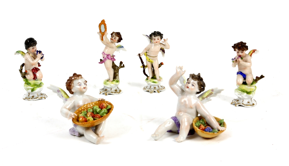 Continental porcelain figures of cherubs with musical instruments, one holding a flaming heart, - Image 2 of 2