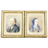 Pair of watercolour portraits of a Victorian man and a woman in black, the woman with blue bonnet,