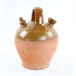 Brown part glazed terracotta oil bottle with ring handle 26cm Provenance: Part of 35 lot