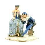 Royal Dux Bohemia, circa 1910, porcelain figurine of a jester/pierrot kissing the hand of a lady,