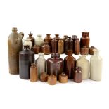 28 stoneware ink bottles the tallest 30cm the shortest 4.5cm Provenance: Part of 35 lot collection