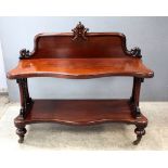 19th century mahogany buffet, serpentine fronted with carved motif to back centre, 118cm wide.