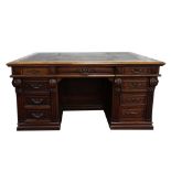 Early 20th partners carved oak desk with leather top, nine drawers on each side, 77cm x 161cm x