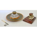 Walnut and brass mounted circular desk stand with cut glass inkwell, and another inkwell with a bone