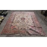 Persian red ground carpet with multiple borders, the centre with foliate forms, 366cm x 260cm .