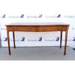 Late 19th century serpentine mahogany serving table with two drawers on square tapering supports and
