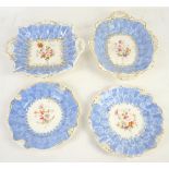 19th century Staffordshire part dessert service with blue borders, the centres painted with