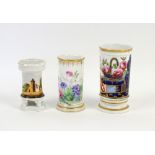 A 19th century spill vase highlighted in gilt painted with a landscape scene and a basket of flowers