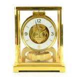 Jaeger LeCoultre Atmos 8 day clock, in gilt metal and glass case, 18 x 22 x 13.5 cm. Generally in