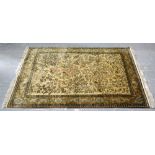 Persian cream ground silk rug , with a main brown border, the centre with repeating foliate forms
