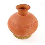 Terracotta olive oil vase with horizontal bands of painted decoration 30cm high .