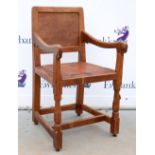 Robert 'Mouseman' Thompson of Kilburn, oak armchair with buttoned brown leather seat, raised on