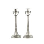 A pair of French Art Nouveau pewter candlesticks, marked Dedale to base. Good patina. Some