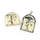 Mary Wondrausch, two Adam & Eve arch top wall plaques each decorated in slip ware, both monogramed,