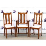 Set of eight oak Arts & Crafts chairs including two carvers, curved top rail and pierced splat