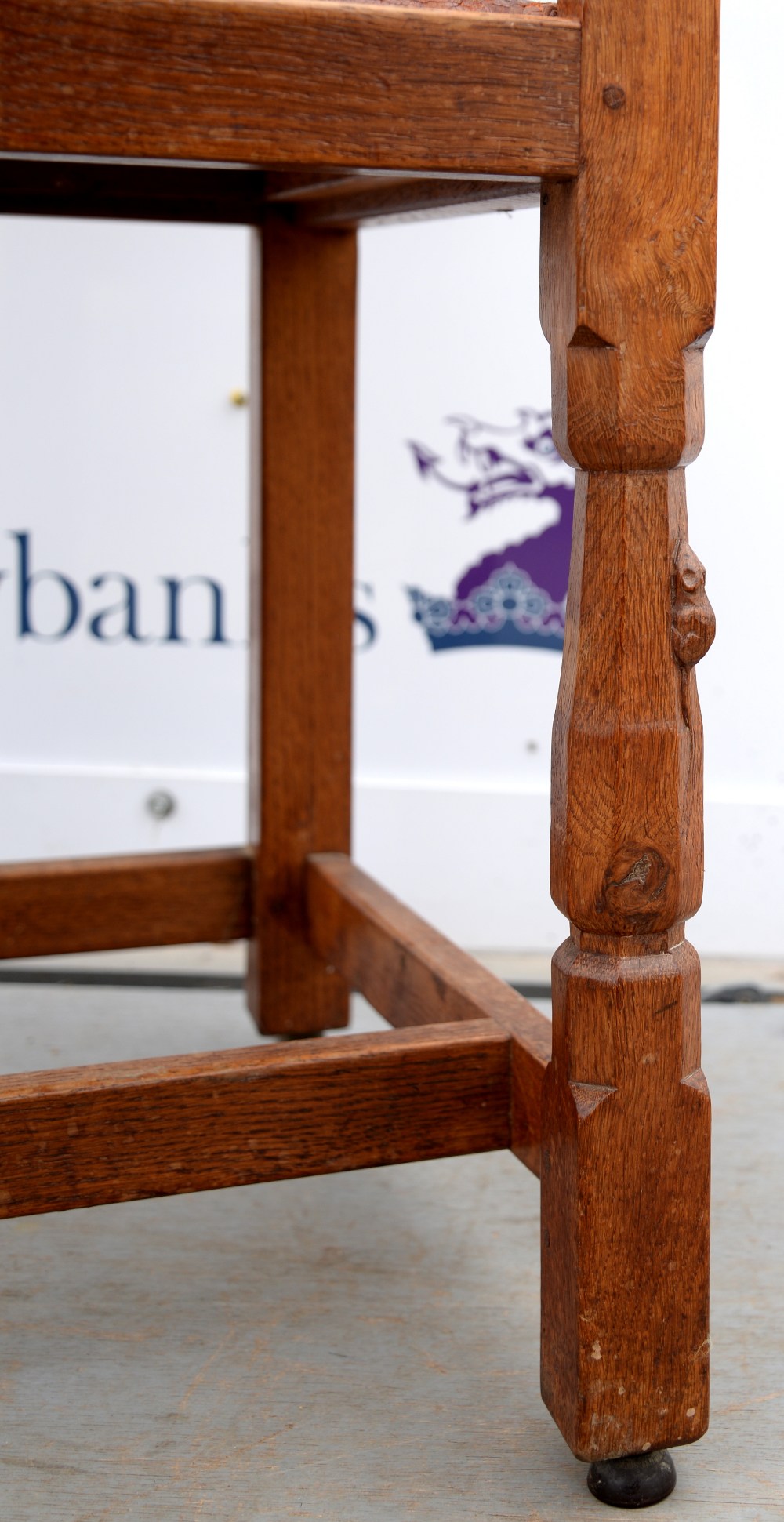 Robert 'Mouseman' Thompson of Kilburn, oak armchair with buttoned brown leather seat, raised on - Image 3 of 4